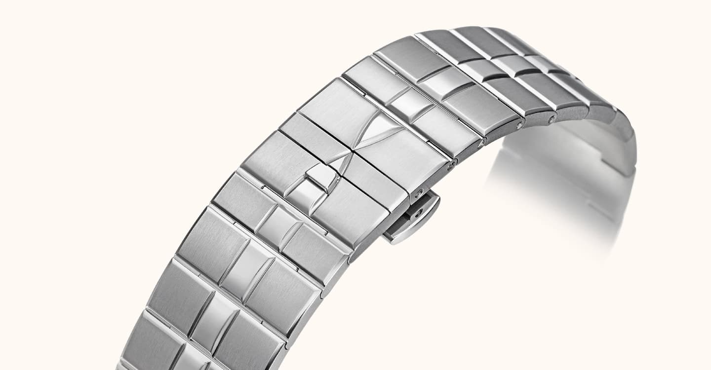 A sleek, modern stainless steel timepiece bracelet with a polished finish.