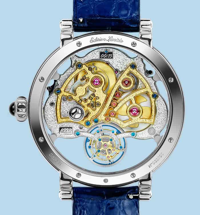 The image shows a luxurious skeleton timepiece with intricate gold and silver components, showcasing.
