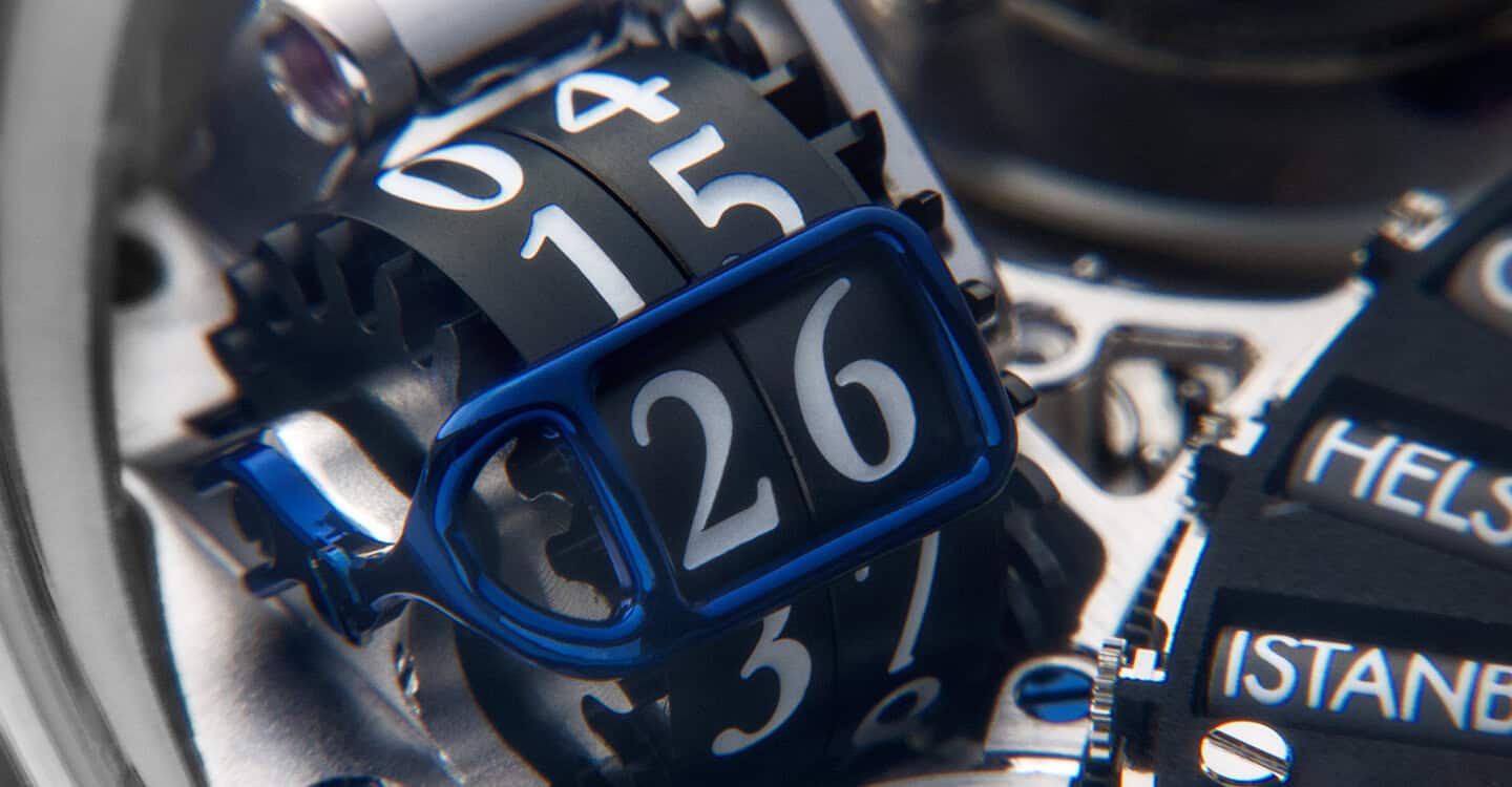Close-up of a Bovet timepiece with a distinctive flip display and intricate mechanical details.