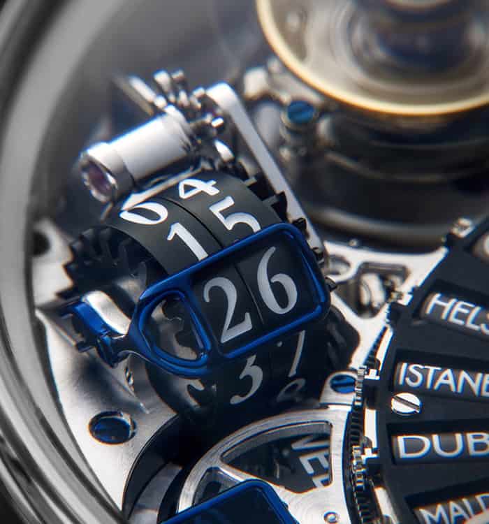 Intricate close-up of a Dimier timepiece with detailed mechanical components and blue accents.