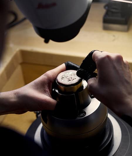 A detailed close-up of a craftsman assembling a luxury timepiece, emphasizing precision and craftsma.