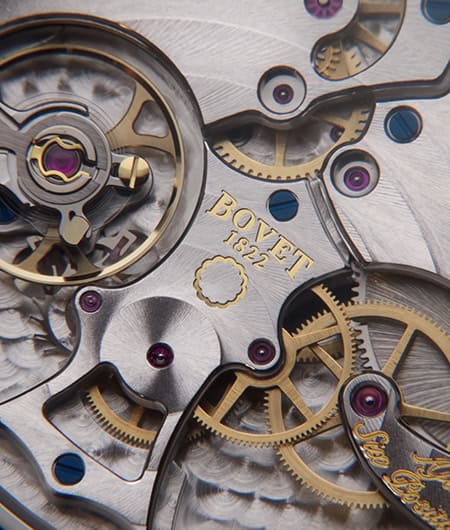 Intricate close-up of a Bovet Fleurier 19Thirty timepiece showcasing detailed gears and craftsmanshi.