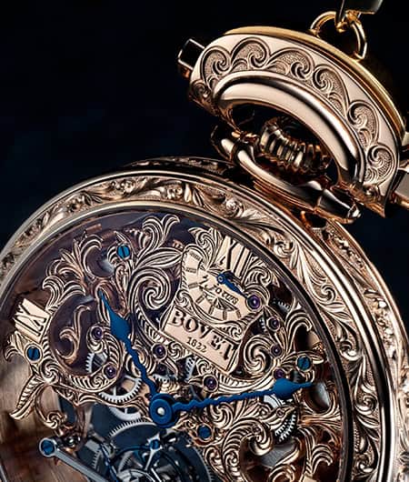 Luxurious Amadéo Tourbillon timepiece with intricate engravings and blue hands.
