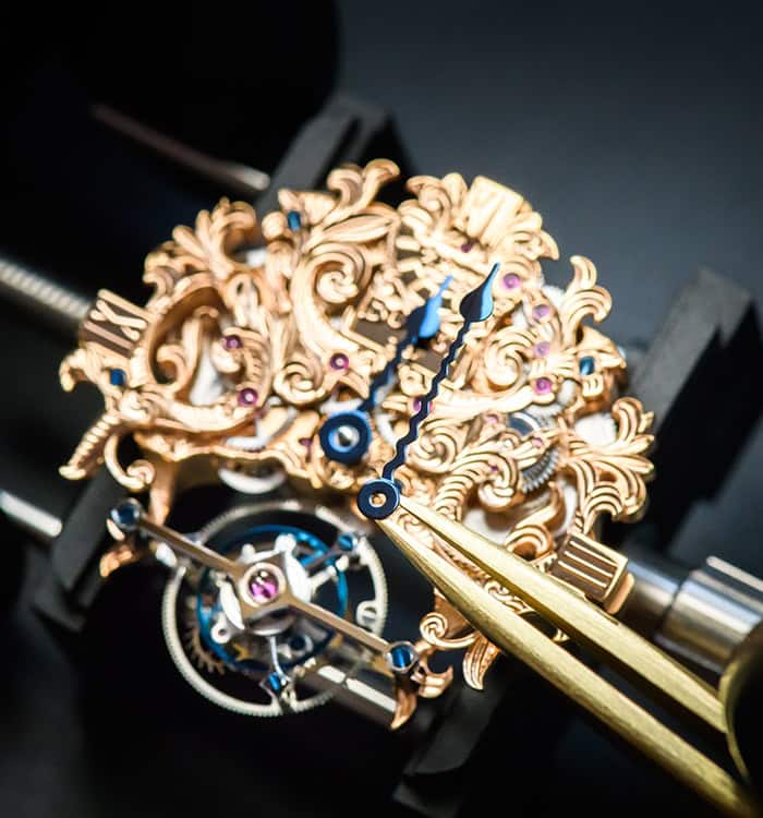 Luxurious Amadéo Tourbillon timepiece with intricate gold detailing and blue accents.