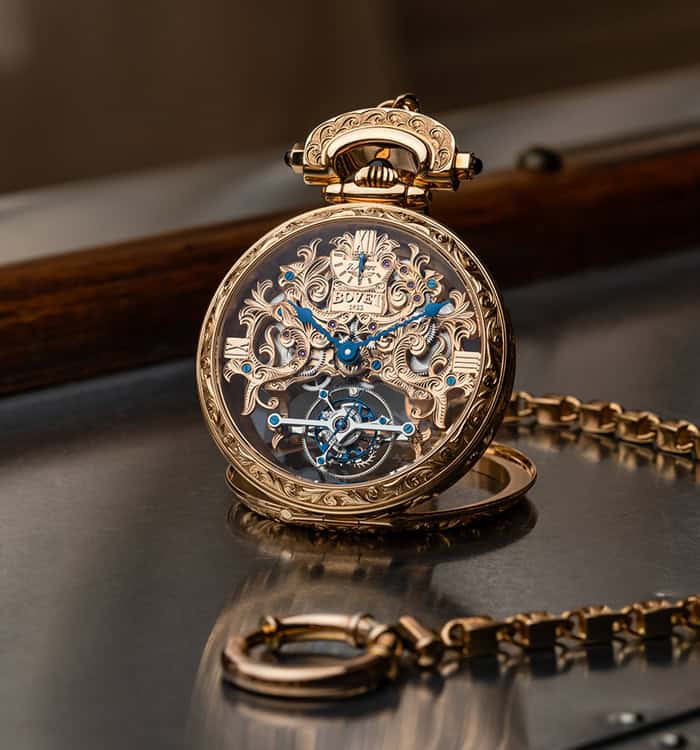 Luxurious Amadéo Tourbillon timepiece with intricate gold detailing and blue accents.