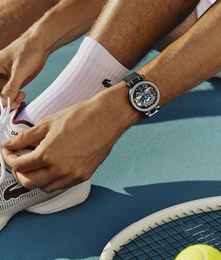 A sleek Bovet timepiece worn on a person's wrist during a tennis match.