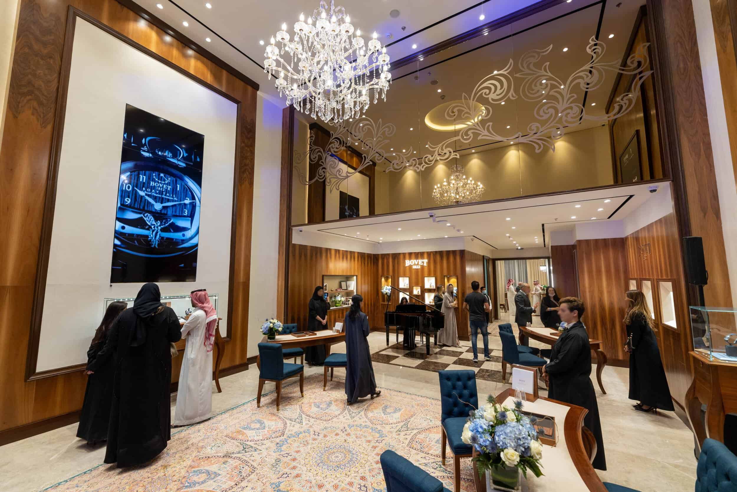 Elegant Bovet boutique interior with luxurious decor and visitors exploring exclusive timepieces in.