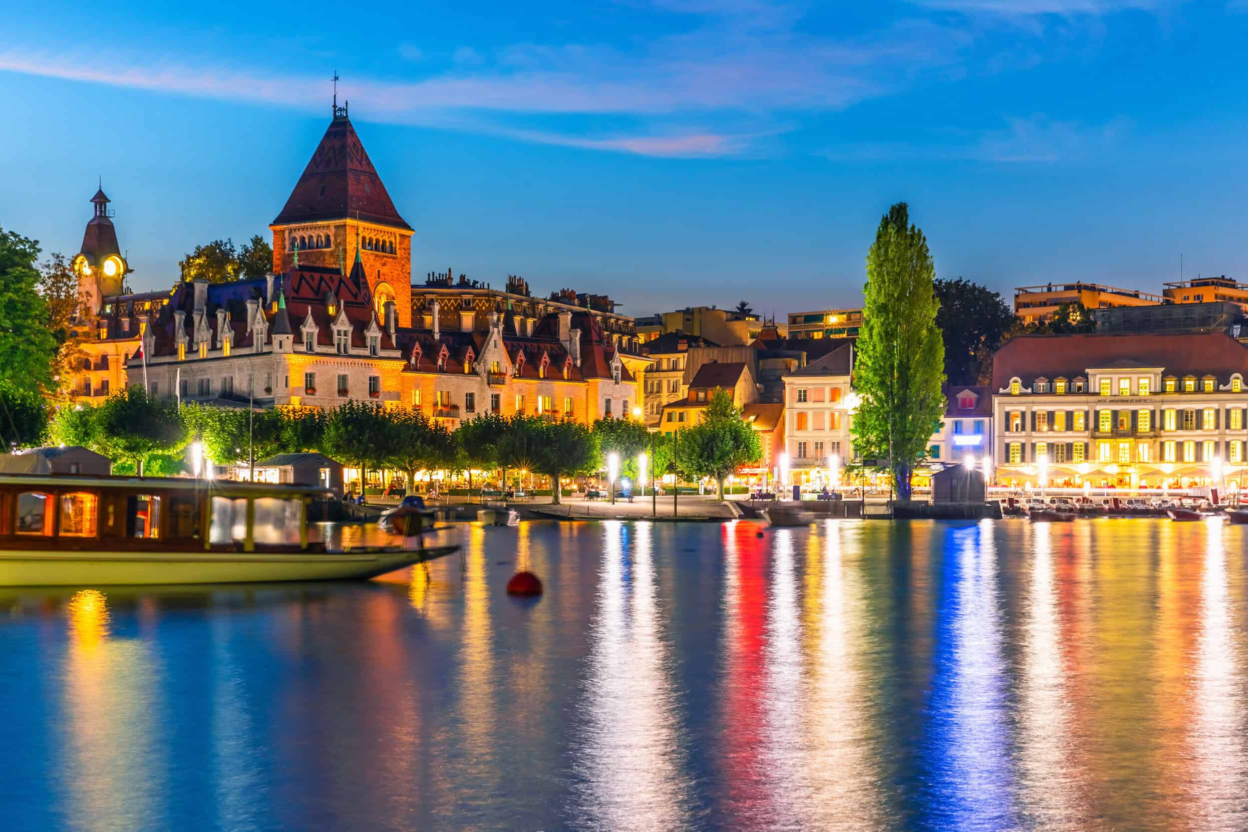 Elegant timepiece displayed with a scenic riverside cityscape at dusk.