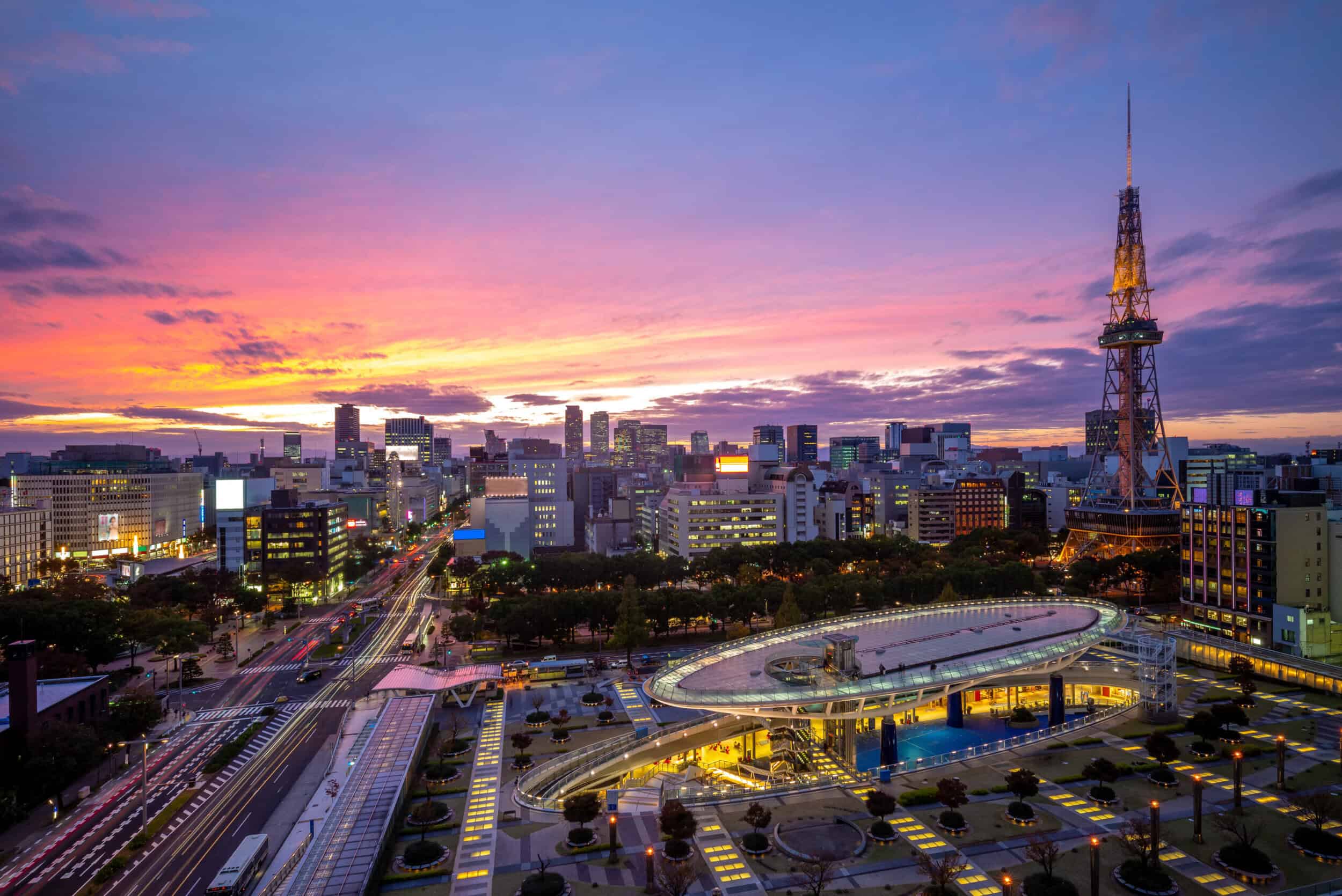 Elegant cityscape of Nagoya with skyline and vibrant sunset.