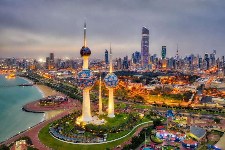 A stunning aerial view of Kuwait City skyline featuring iconic skyscrapers and the Kuwait Towers at.