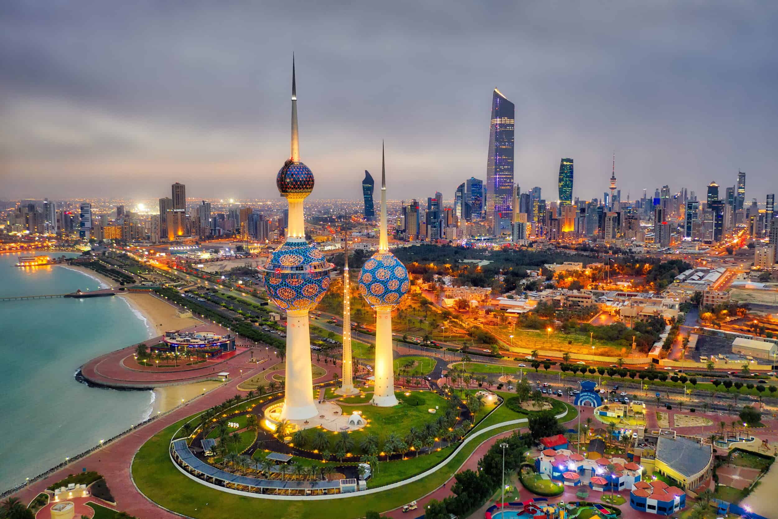 A stunning aerial view of Kuwait City skyline featuring iconic skyscrapers and the Kuwait Towers at.