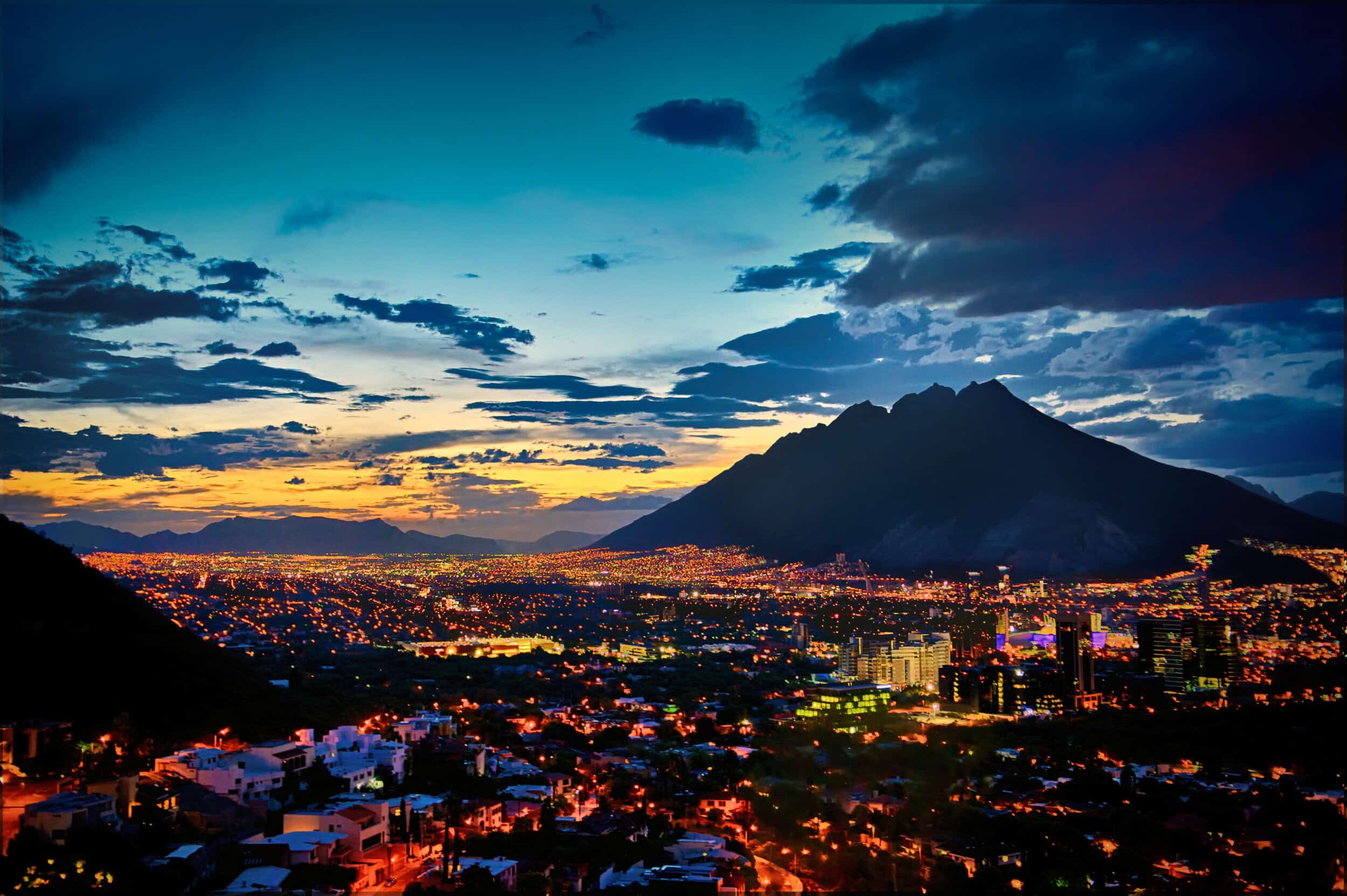 City at night below the montains, EMWA Valle
