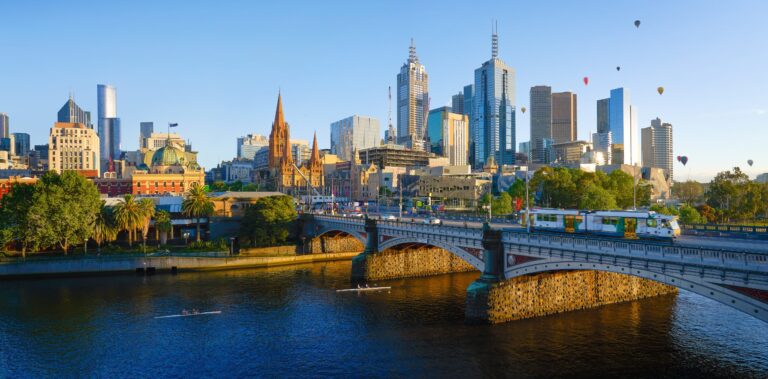 Elegant skyline of Melbourne with modern skyscrapers and historic architecture, showcasing luxury ti.