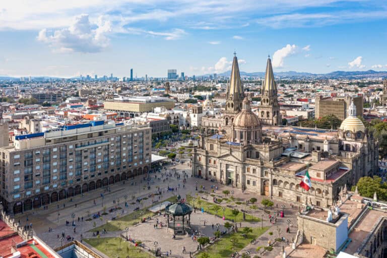 Panoramic view of Guadalajara featuring historic architecture and city skyline.