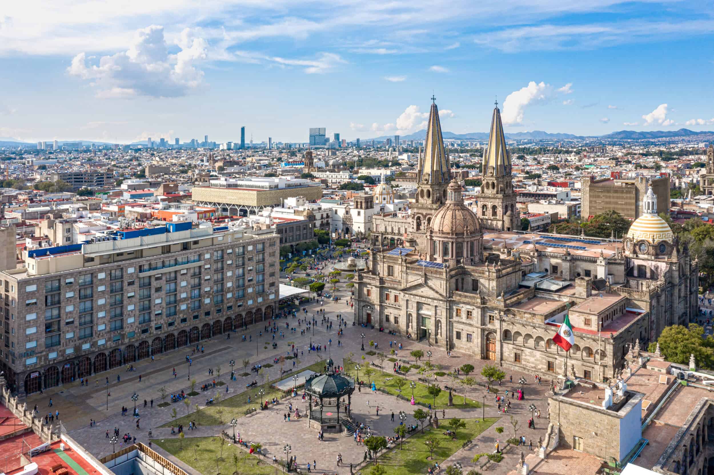 Panoramic view of Guadalajara featuring historic architecture and city skyline.