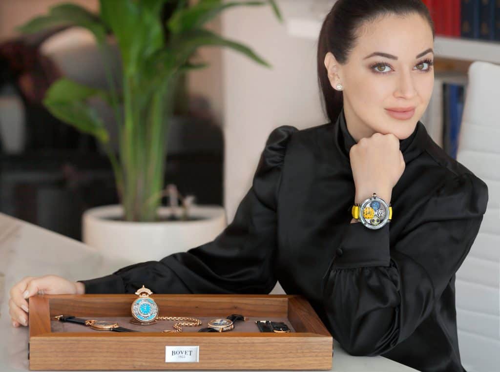 Elegant woman showcasing Bovet timepieces, emphasizing craftsmanship and luxury in a sophisticated s.