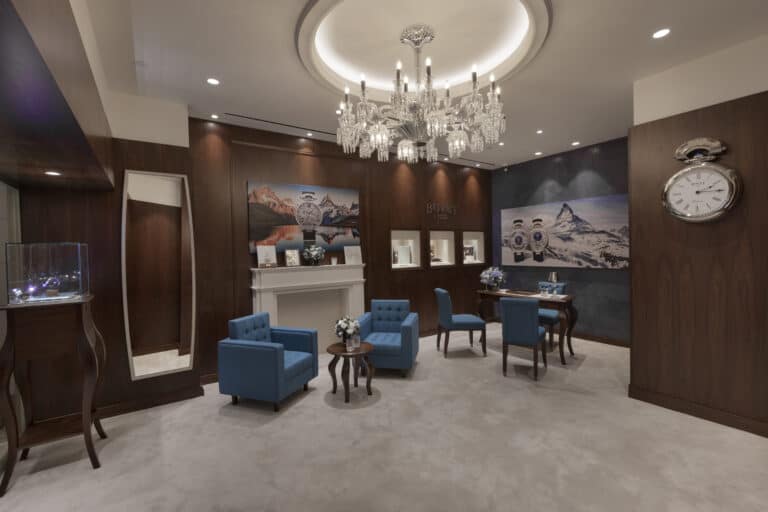 Elegant Bovet showroom interior showcasing luxurious timepieces in a sophisticated setting with plus.