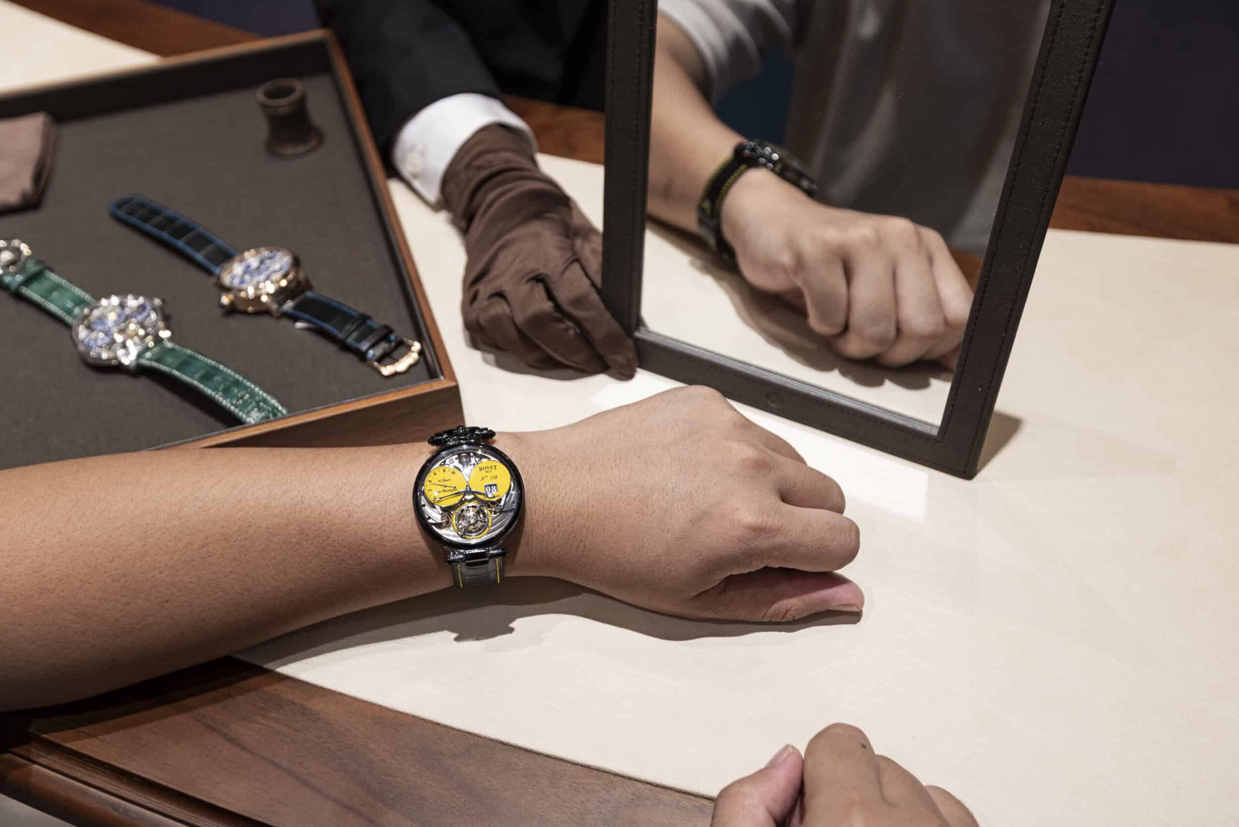 Luxurious timepiece showcased on a wrist with a reflection in a mirror, highlighting craftsmanship a.
