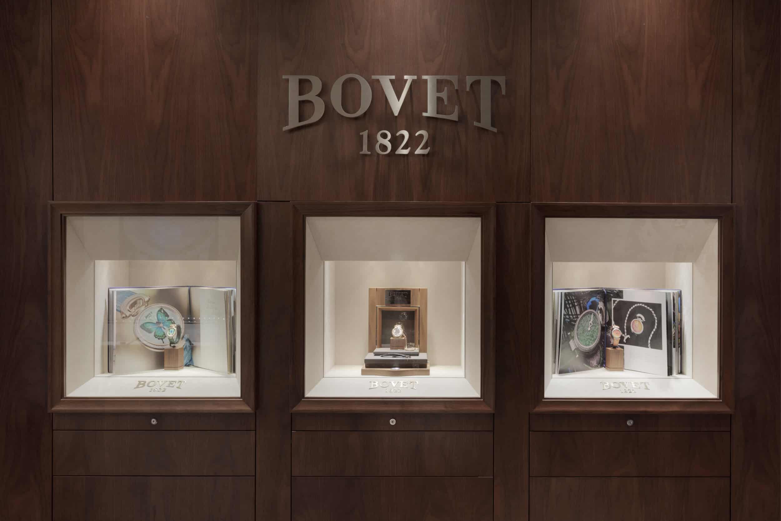 Elegant Bovet display with luxurious timepieces showcased in a sophisticated wooden setting.