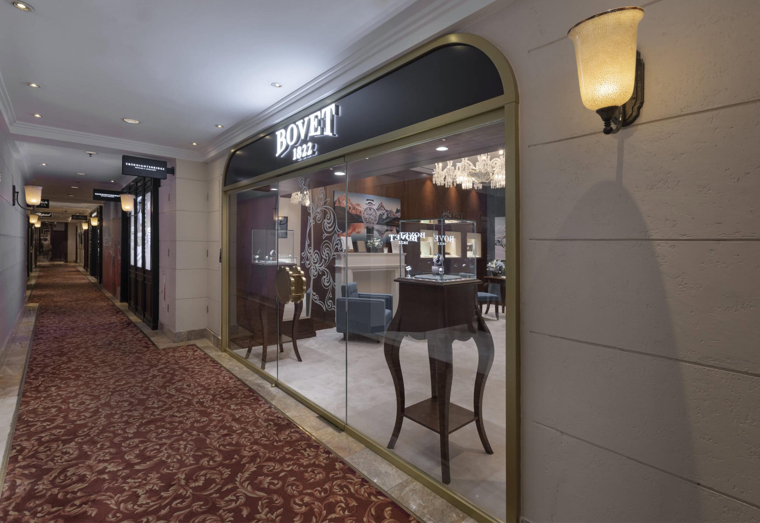 Elegant Bovet boutique storefront showcasing luxury timepieces in a sophisticated setting.