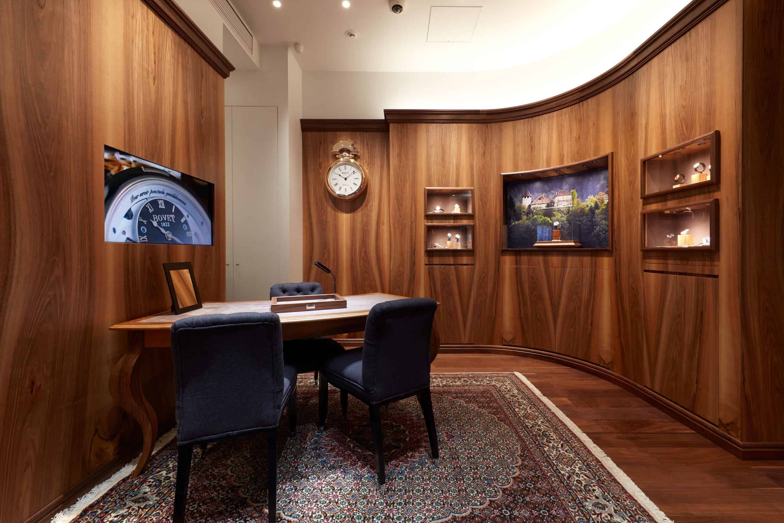 Elegant interior of Bovet Tokyo showroom showcasing luxury timepieces and sophisticated decor.