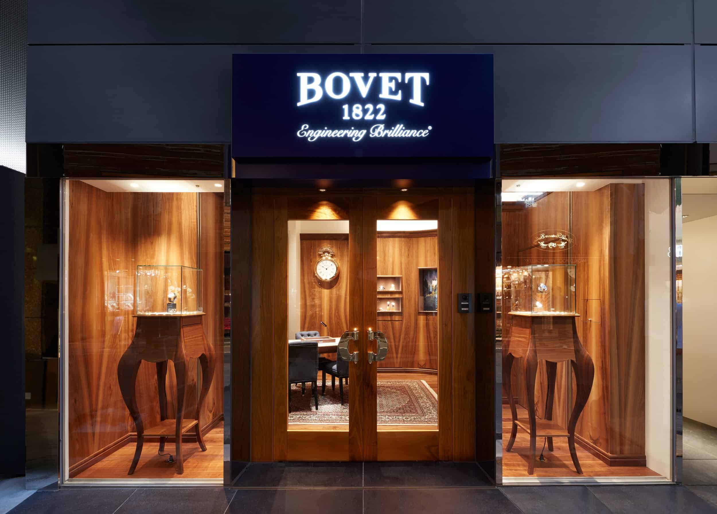 Bovet boutique storefront showcasing luxury timepieces in Tokyo, elegant wooden display cases.
