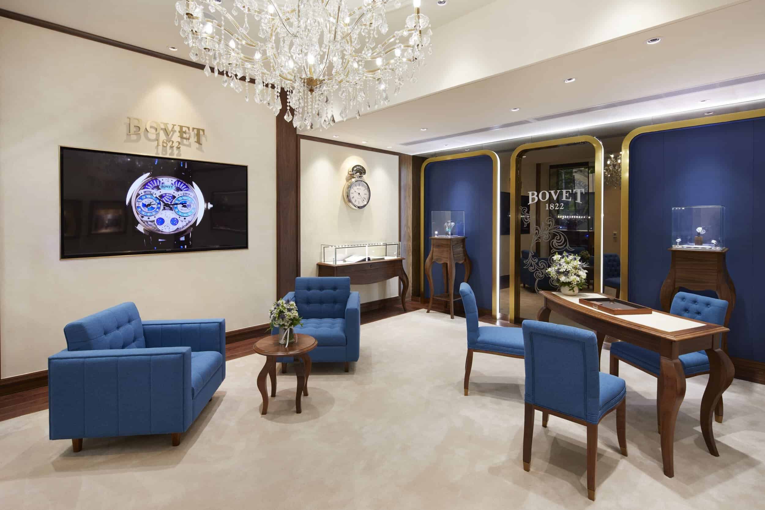 Elegant Bovet showroom interior with luxurious blue seating and display cases, highlighting the bran.