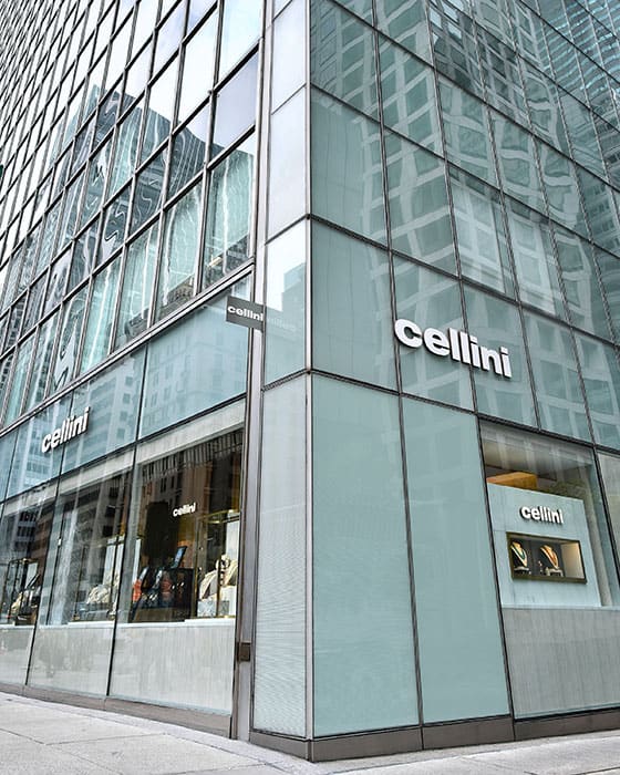 A stunning modern storefront of Cellini Jewelers showcasing luxury timepieces in a sleek glass build.