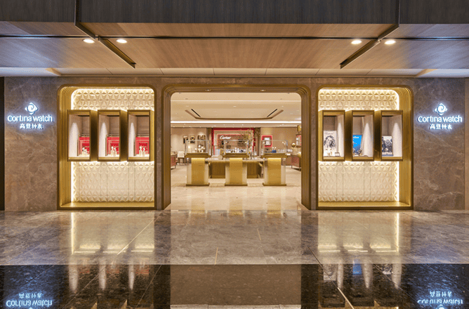 Elegant Cortina Watch Paragon storefront showcasing luxury timepieces in a sophisticated retail envi.