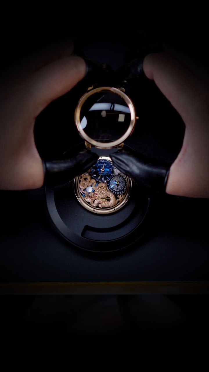 Luxurious Bovet timepiece with intricate mechanical details and golden accents.