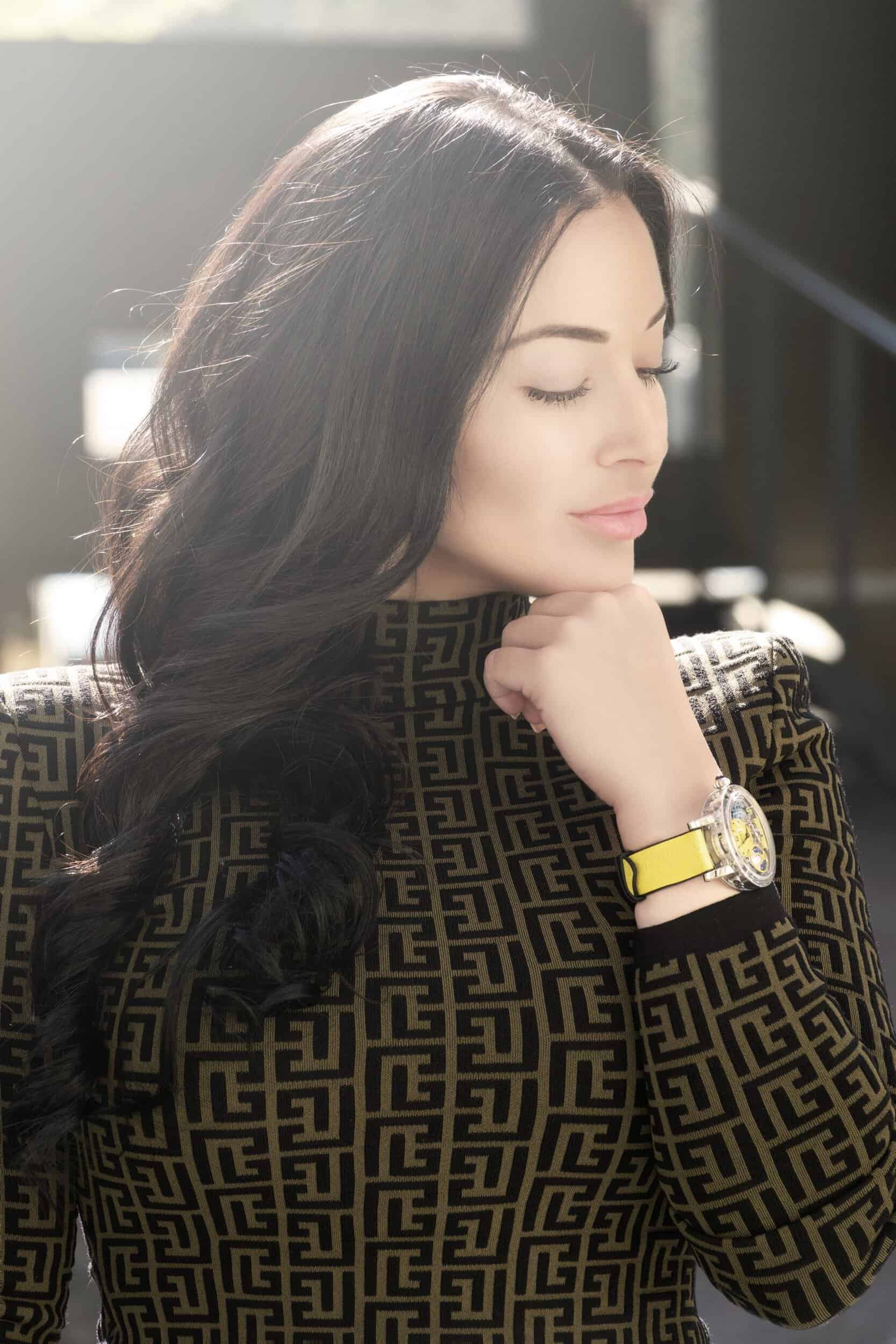 Elegant woman wearing a Bovet timepiece with a luxurious design, highlighting craftsmanship and soph.