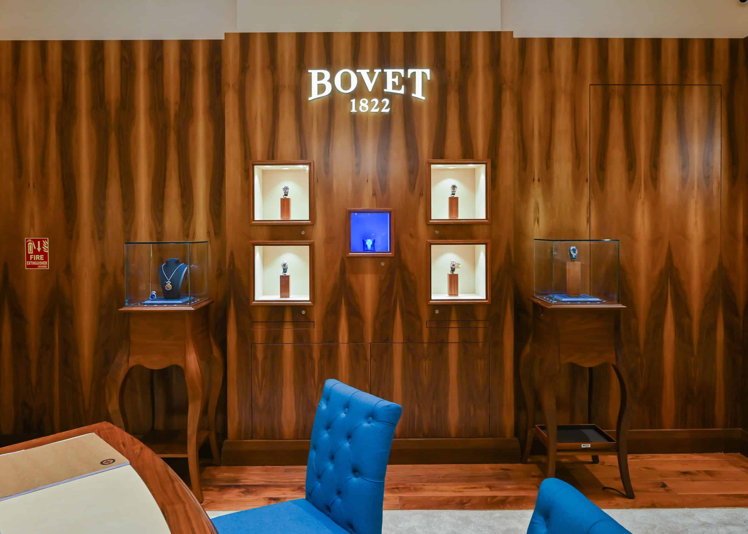 Elegant Bovet display with luxury timepieces in a sophisticated setting.