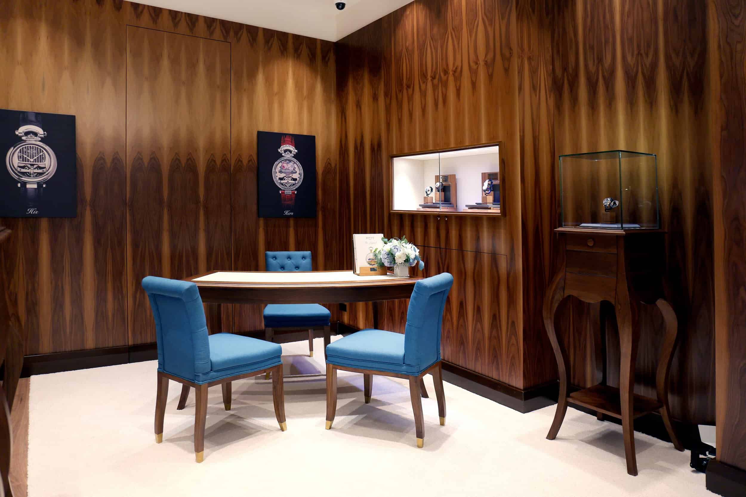 Elegant Bovet timepiece display in a luxurious showroom setting.