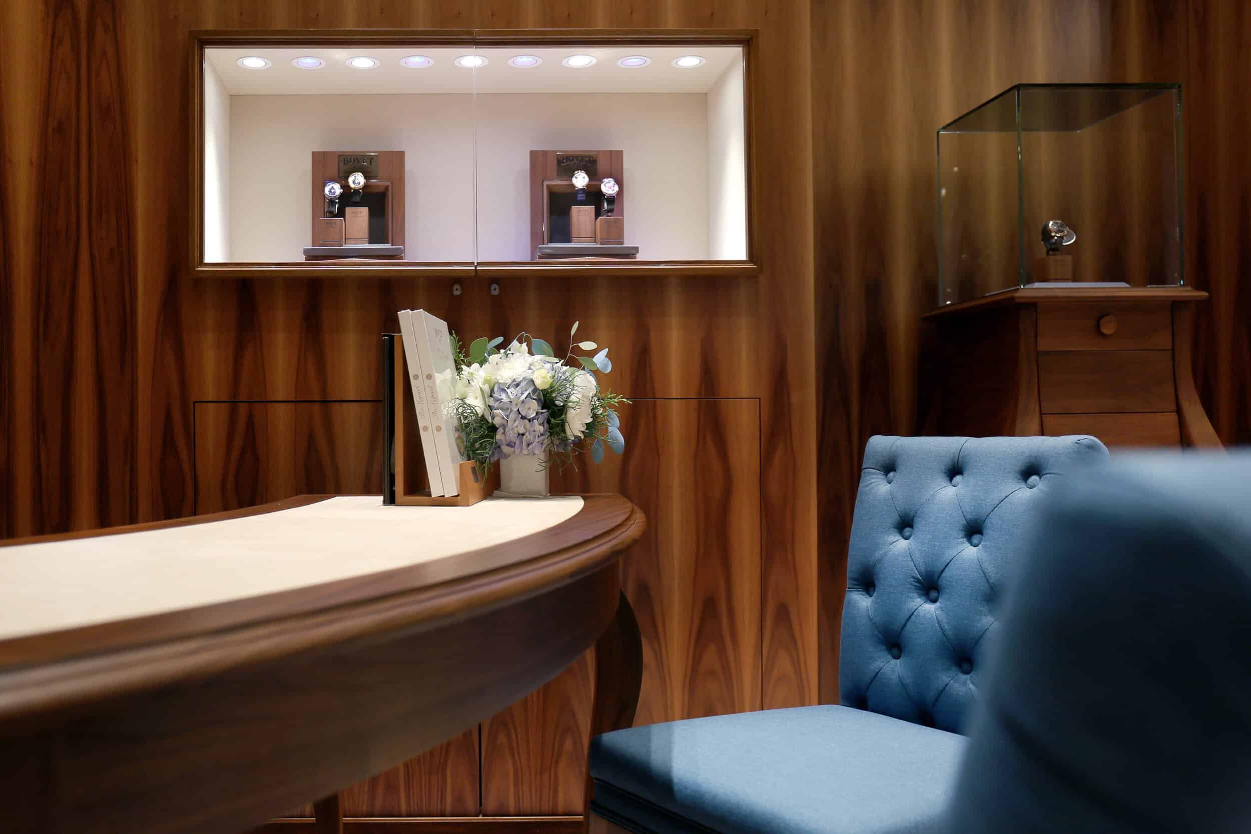 Elegant Bovet timepieces displayed in a luxurious setting with warm wood accents and sophisticated d.