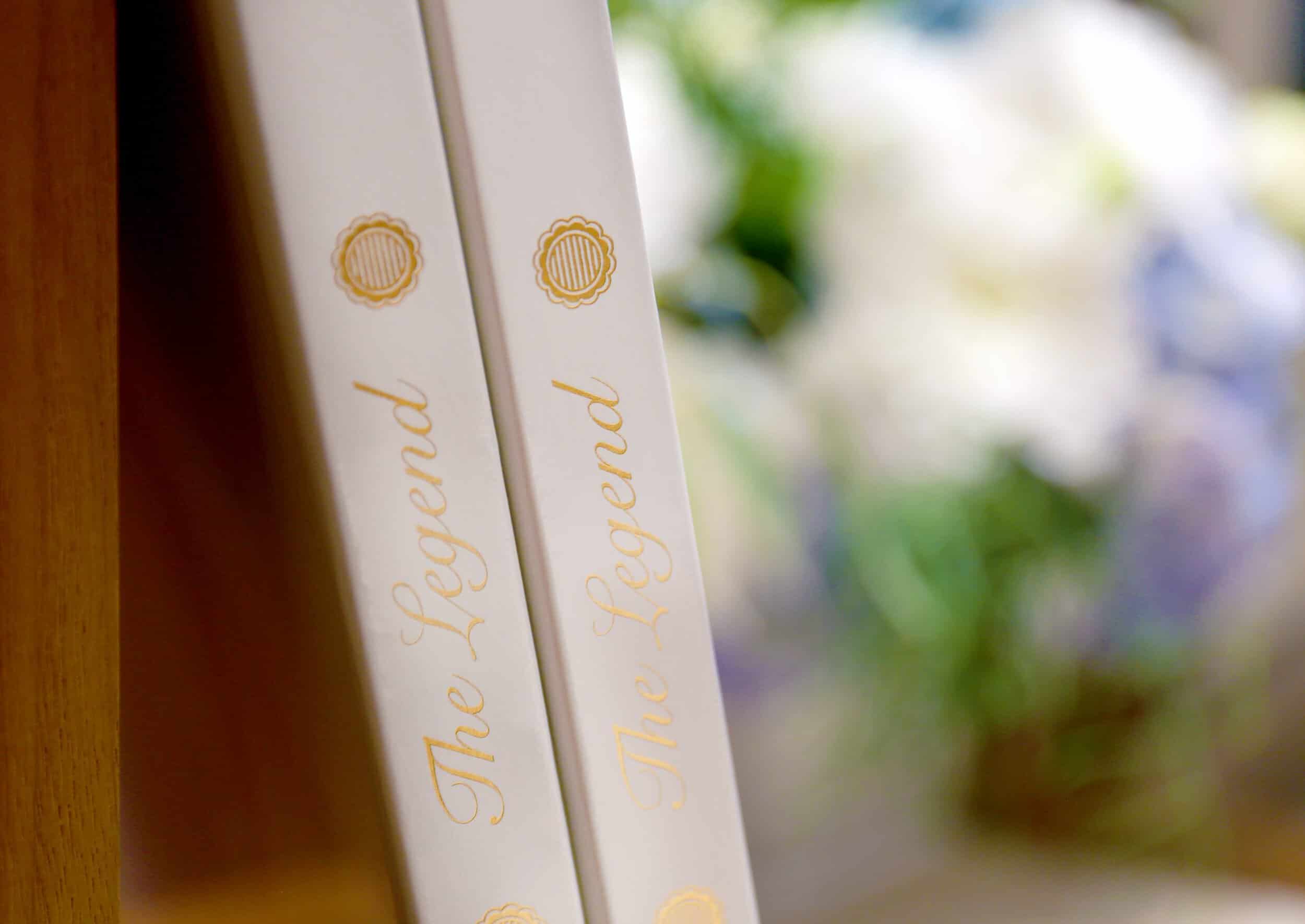 Elegant Bovet timepieces with gold accents displayed on a shelf.