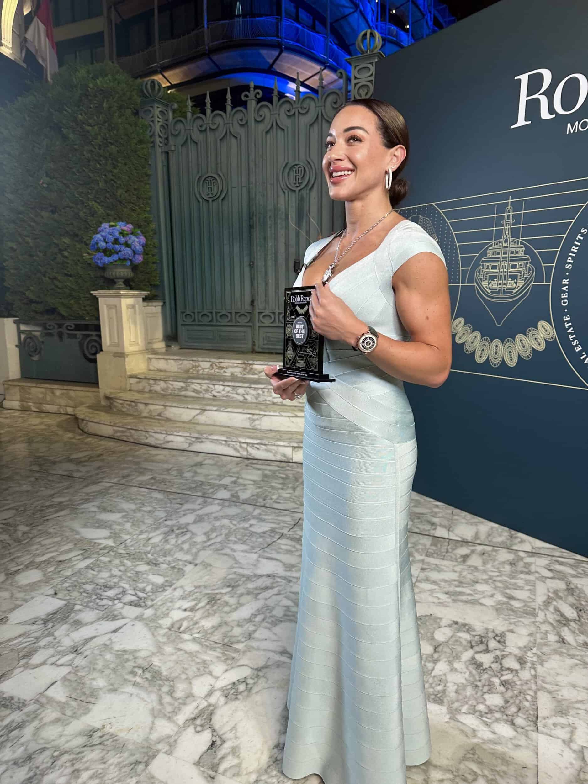 Elegant woman holding a Bovet timepiece at the Robb Report: Récital 30 Best Watch of the Year event.