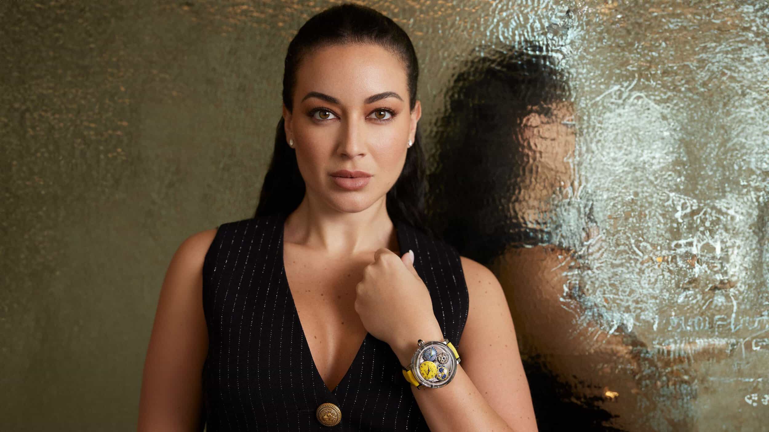 Elegant woman showcasing a luxury timepiece at the Watches if Switzerland Hudsons Yard Event.