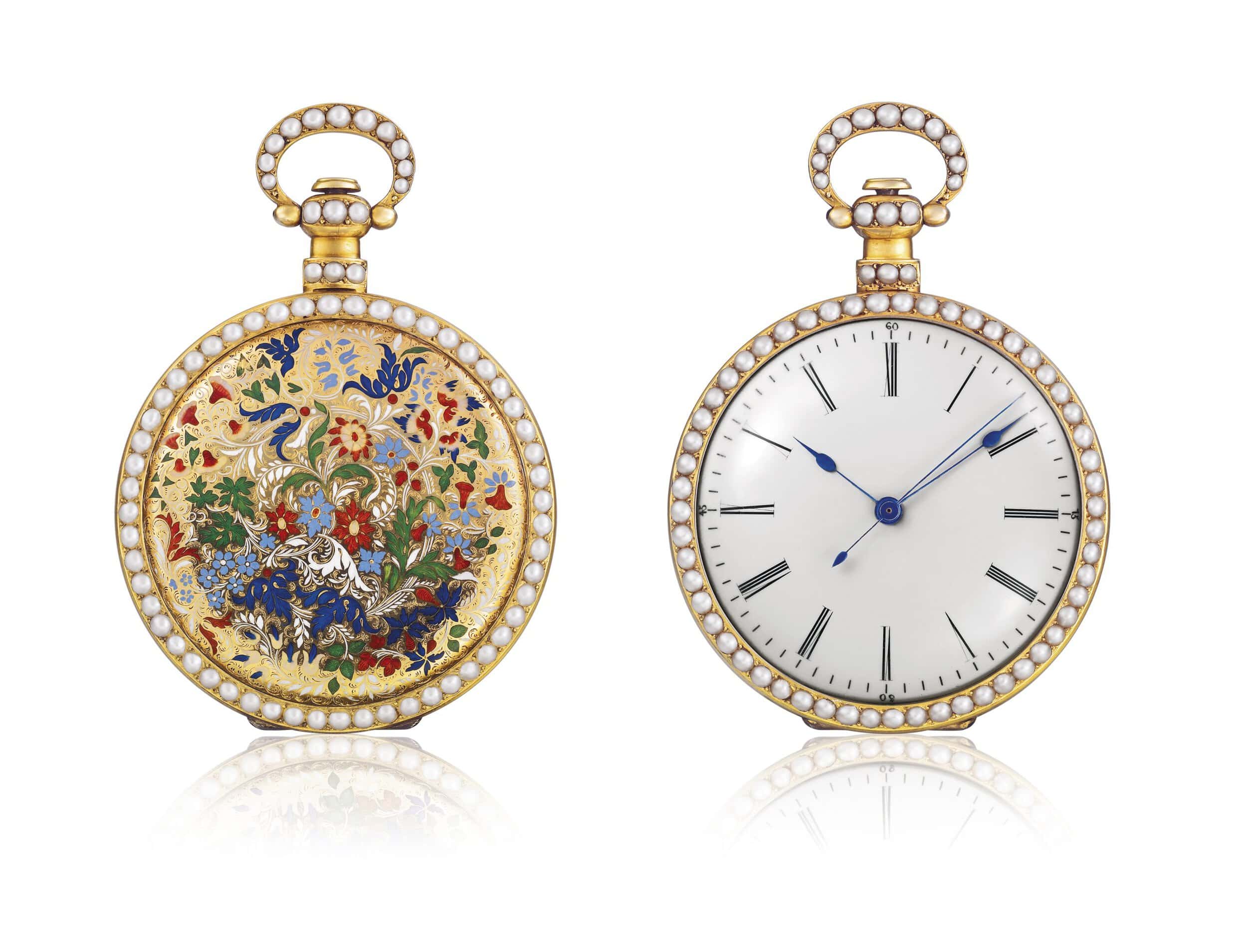 Elegant vintage timepiece with intricate floral and bird design, adorned with pearls and gold accent.
