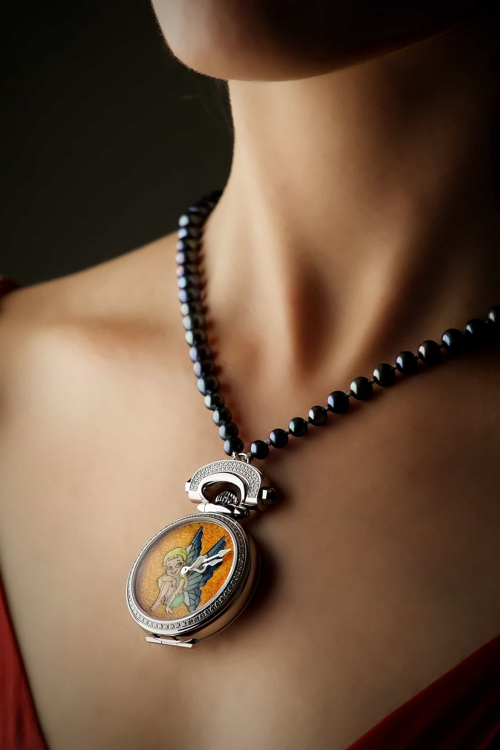 Elegant Miss Audrey Sweet Fairy timepiece with intricate fairy design and gemstone accents.