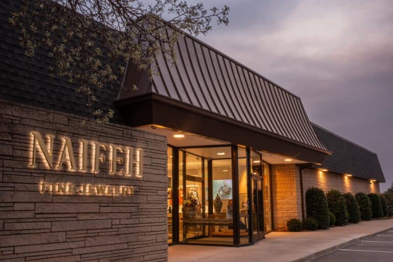 Elegant exterior of Naifeh Fine Jewelry showcasing luxury timepieces display.