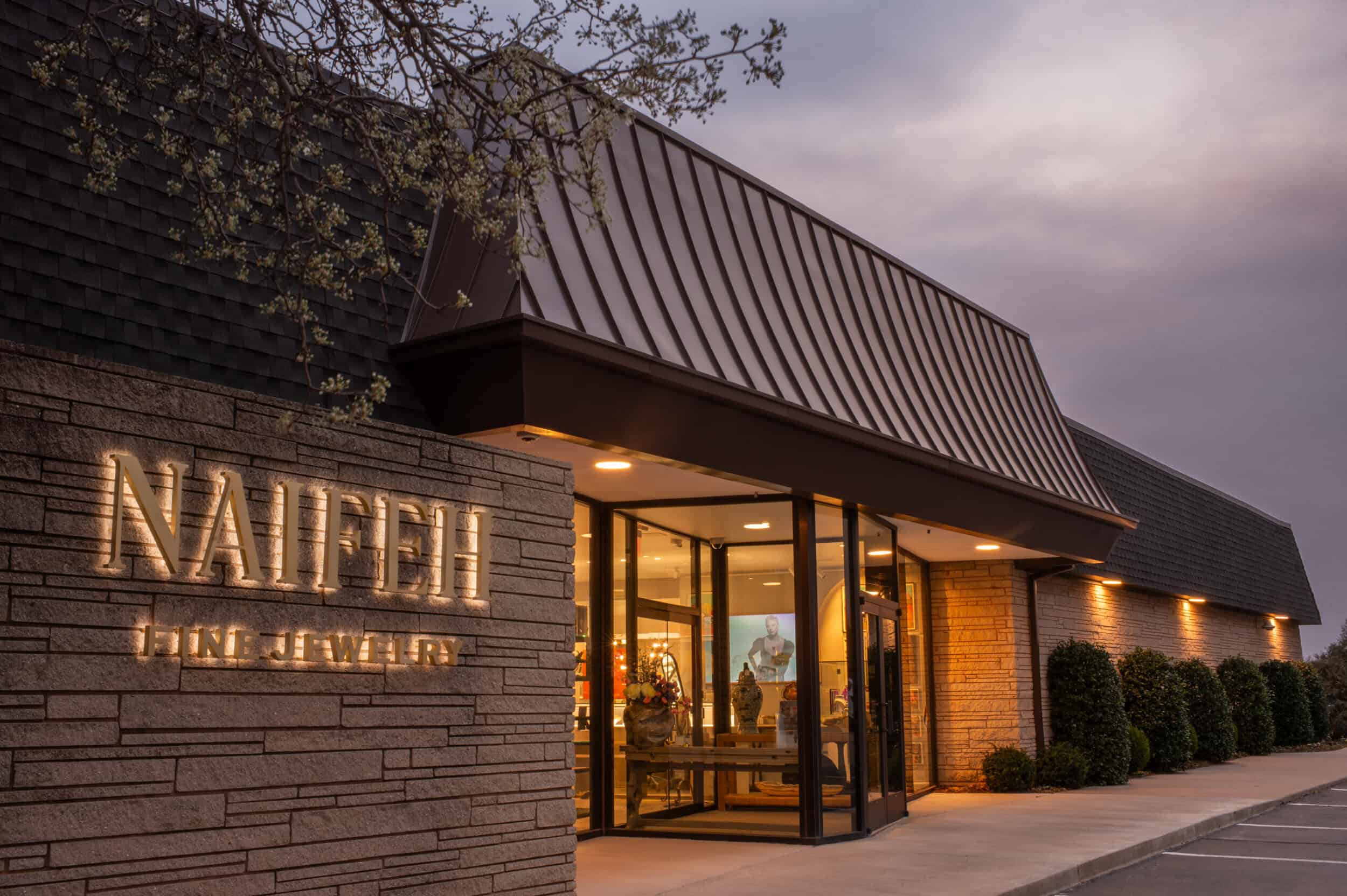 Elegant exterior of Naifeh Fine Jewelry showcasing luxury timepieces display.