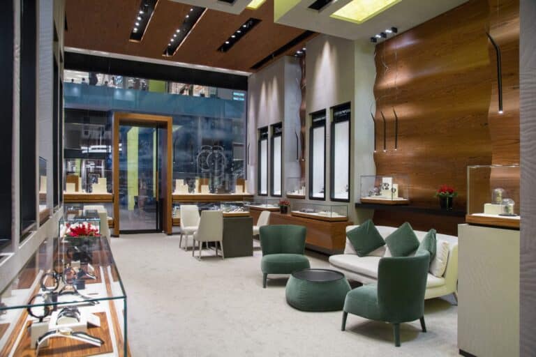 Elegant interior of Bovet boutique showcasing luxurious timepieces in a sophisticated setting.