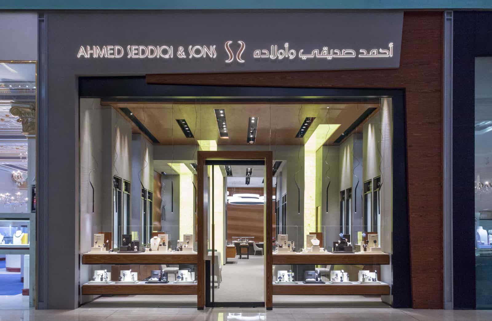 Elegant storefront of Ahmed Seddiqi & Sons showcasing luxury timepieces in Dubai.