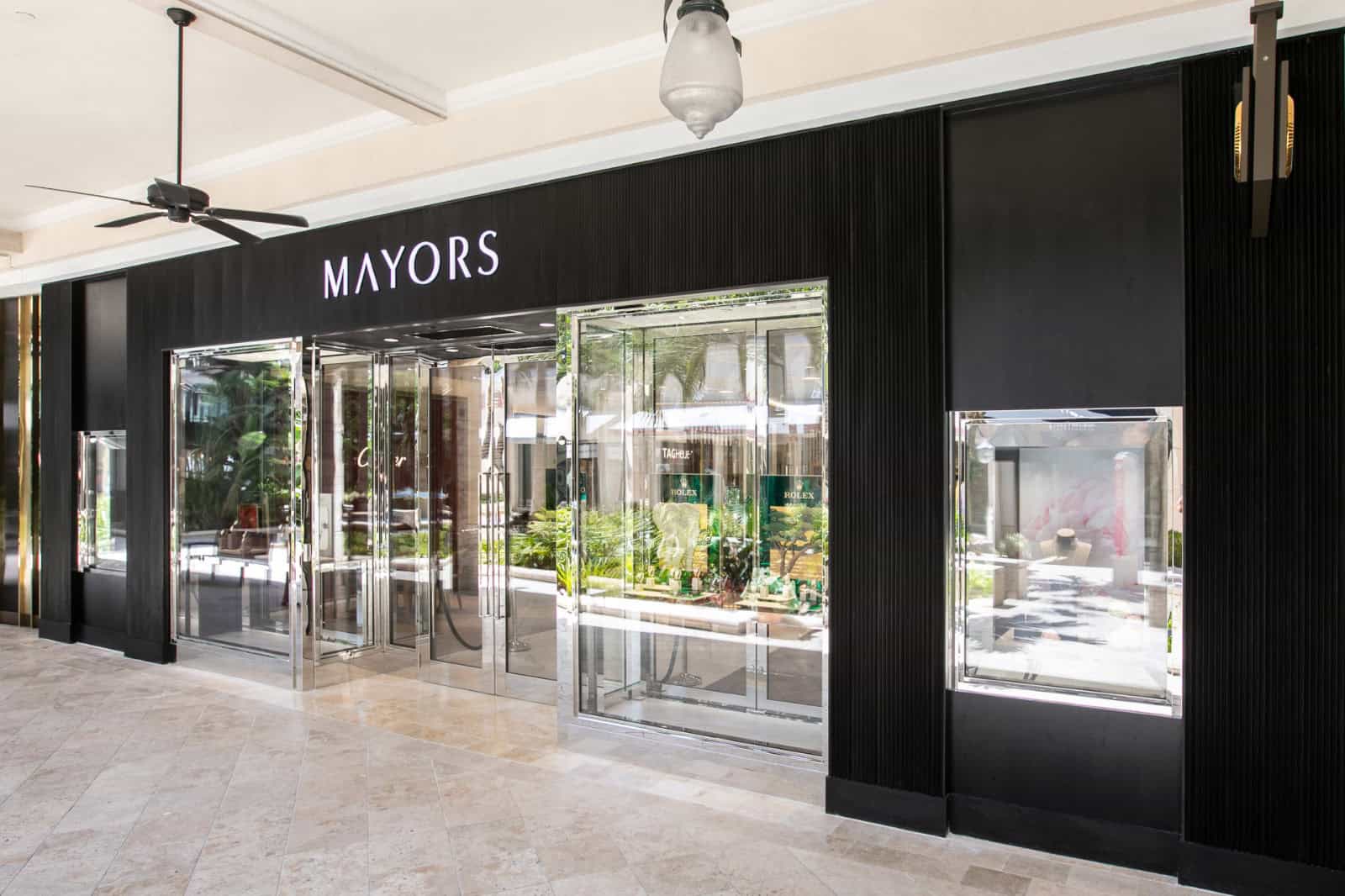 Elegant storefront of Mayors of Merrick Park featuring Bovet 1822 timepieces, showcasing luxury and.