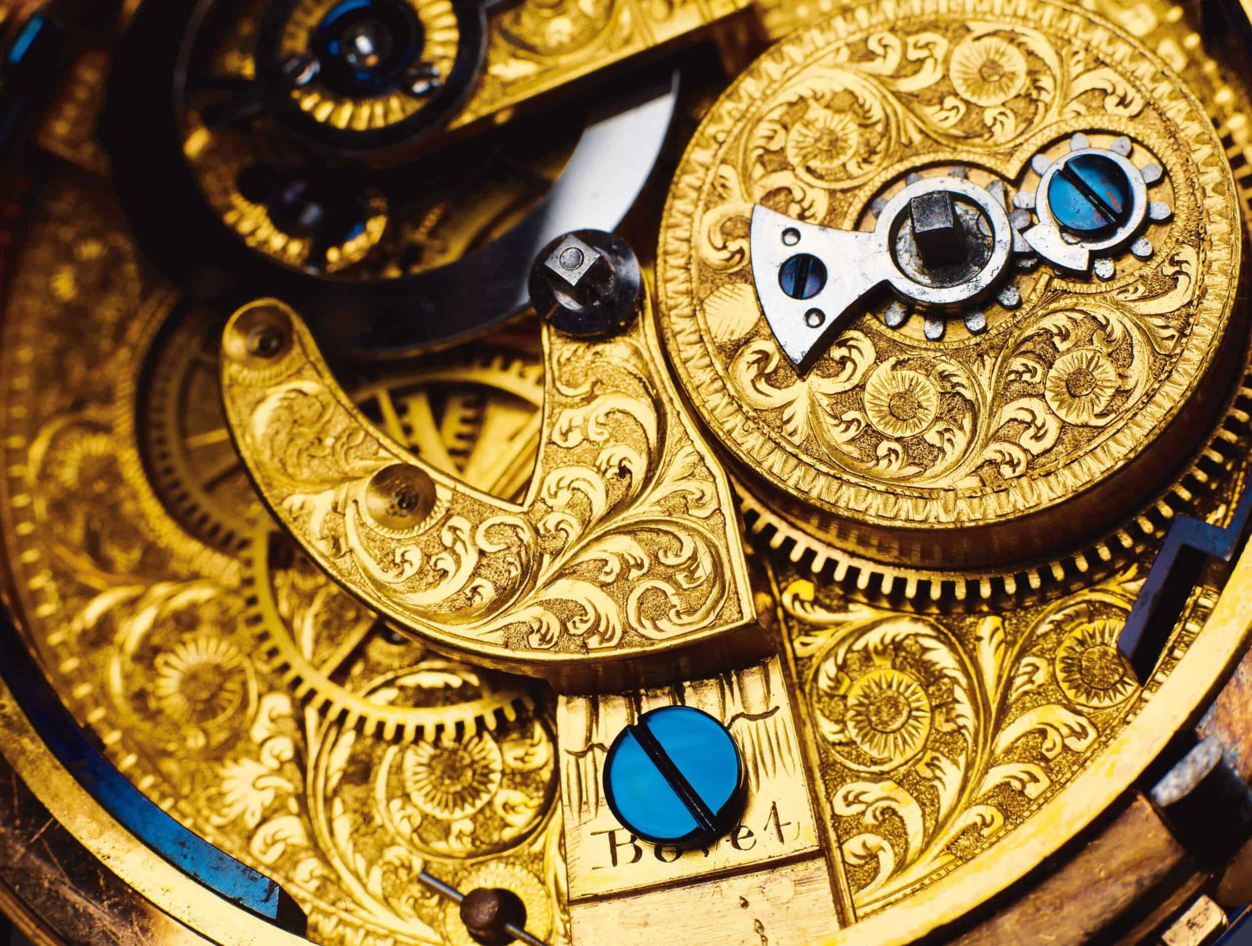 Intricate gold and blue mechanical movement of a Bovet timepiece showcasing craftsmanship.