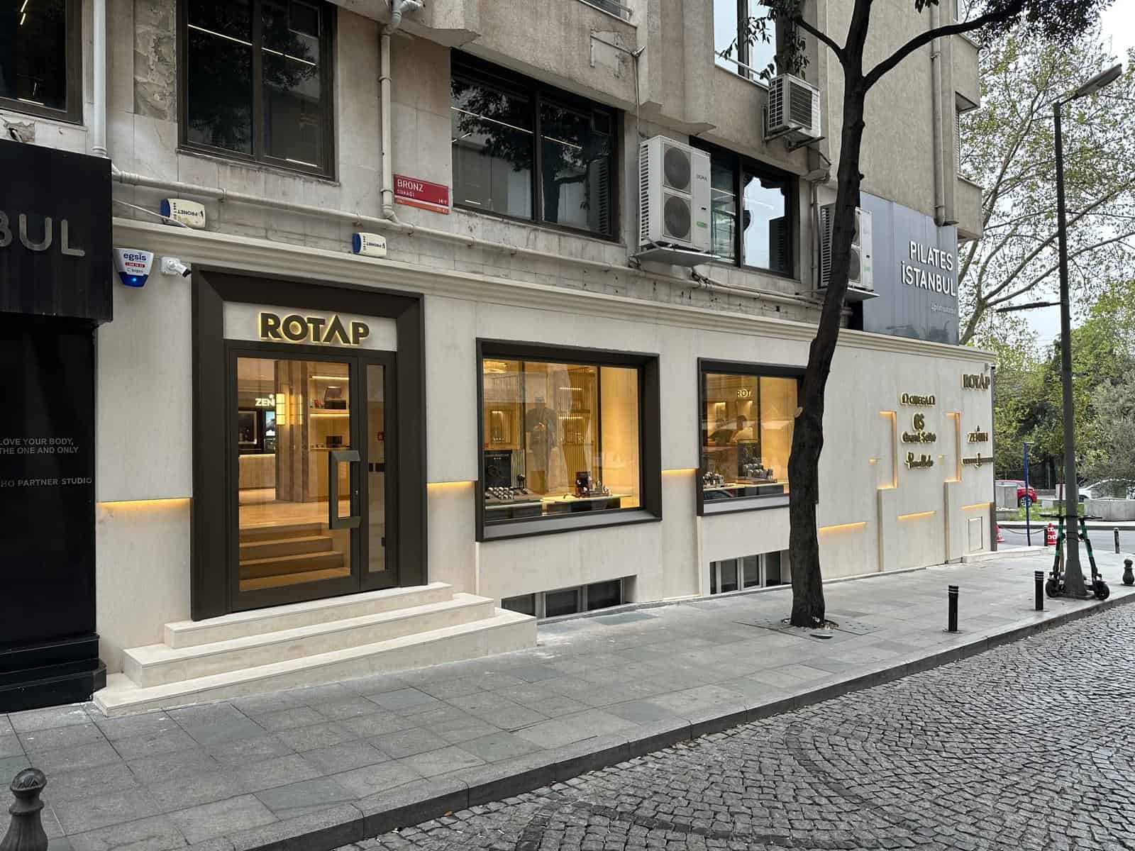 Elegant Bovet boutique storefront showcasing luxury timepieces in a modern urban setting.