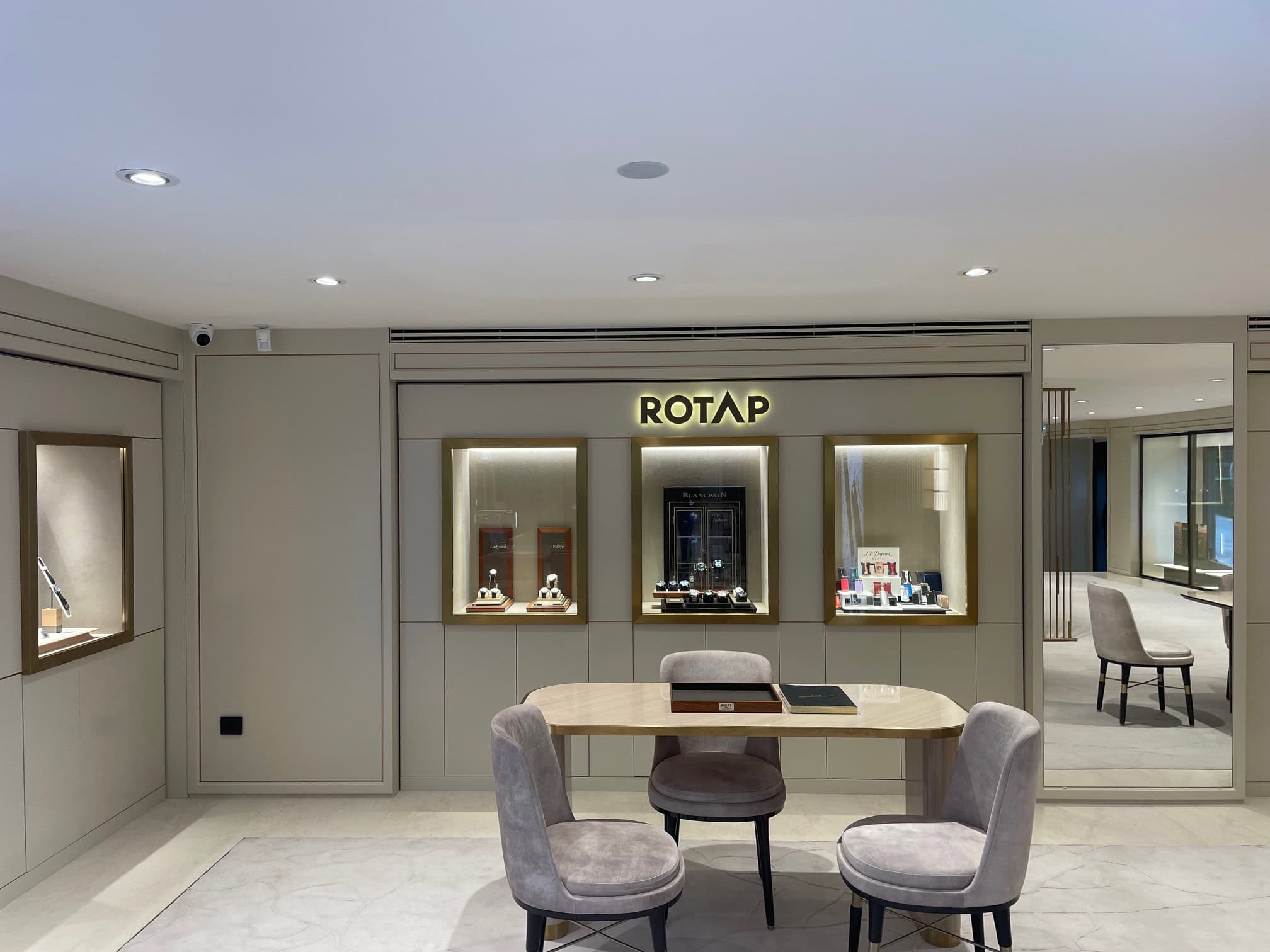 Elegant Bovet timepieces display in Rotap boutique with sophisticated showcase lighting.