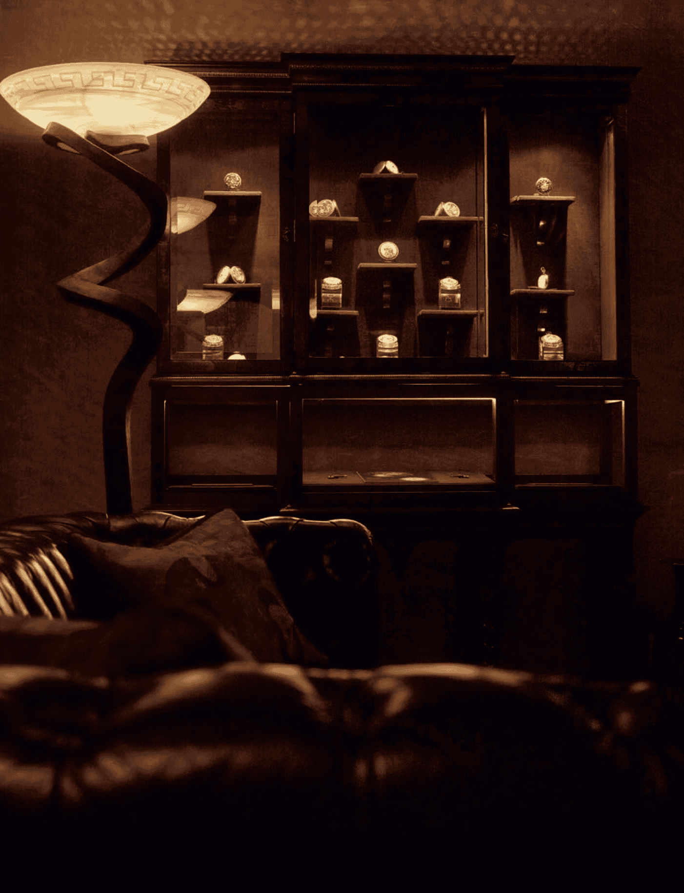 Elegant Bovet timepieces displayed in a luxurious, dimly lit setting.
