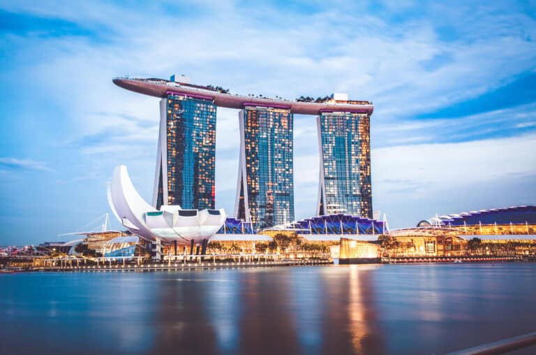 Iconic Marina Bay Sands with skyline, emphasizing luxury timepiece craftsmanship.