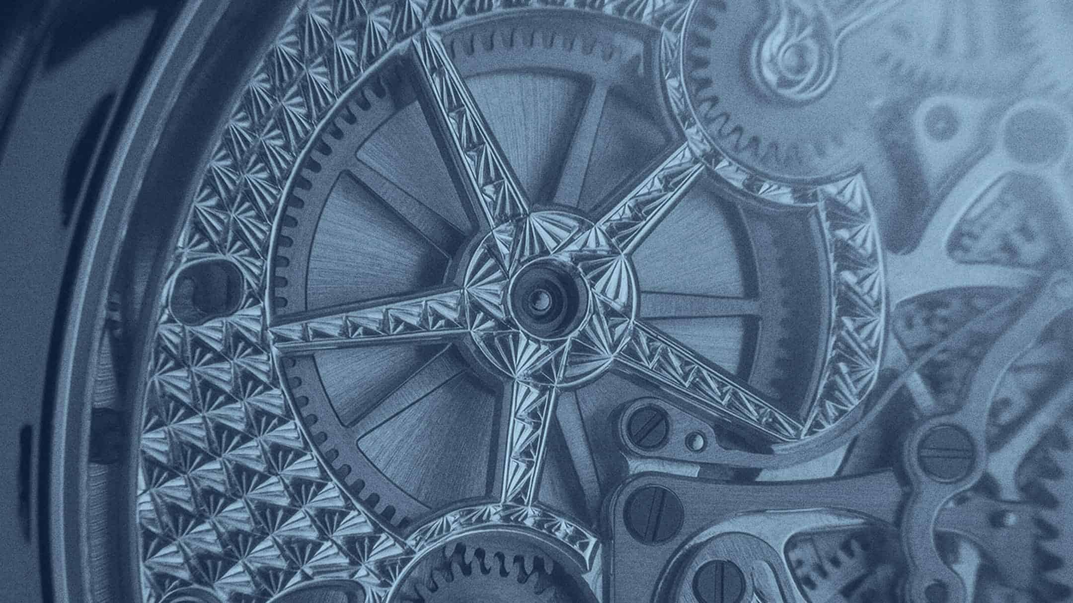 Intricate close-up of a luxury timepiece showcasing detailed craftsmanship and mechanical movement.